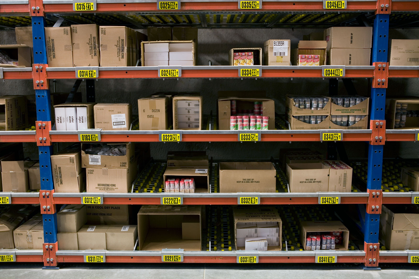 Frazier's SelecDeck Case Flow Rack, with lane dividers, presents product for picking.