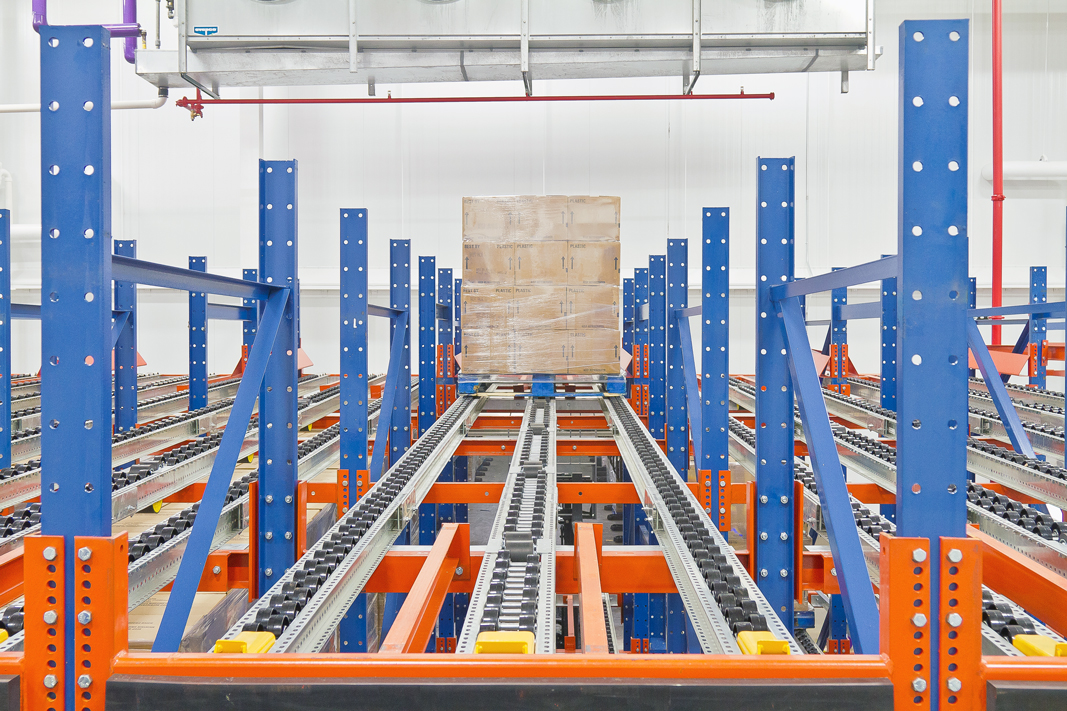 A pallet moves down a Pallet Flow rack system.