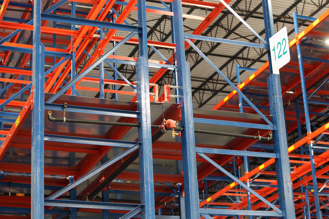 Pallet rack frames with boxed columns.