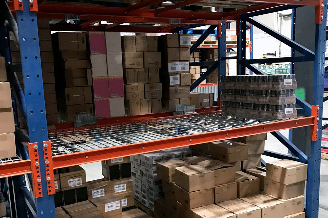 A Sentinel® Selective Pallet Rack with Frazier's Wire Screen.